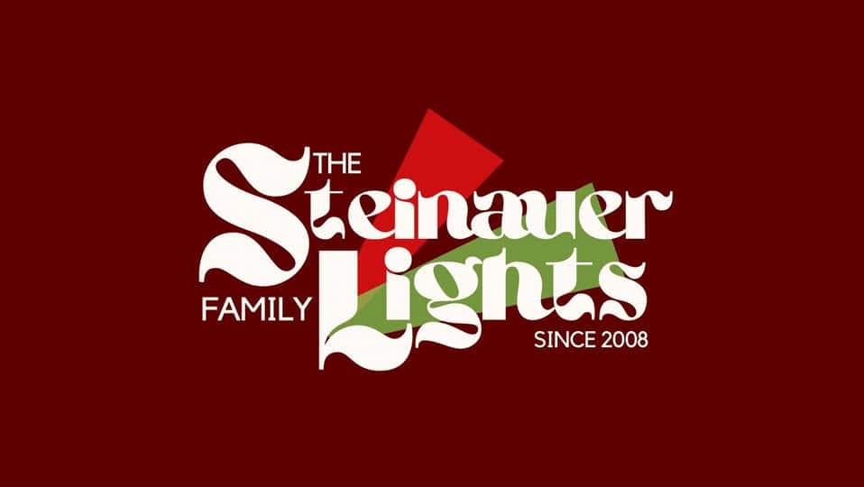 7 Jaw-Dropping Christmas Light Shows in Nebraska You Can’t Miss This Holiday Season (2025 Guide!) 2 Logo with text "The Steinauer Family Lights Since 2008" in stylized white font, featuring red and green geometric shapes on a dark red background.