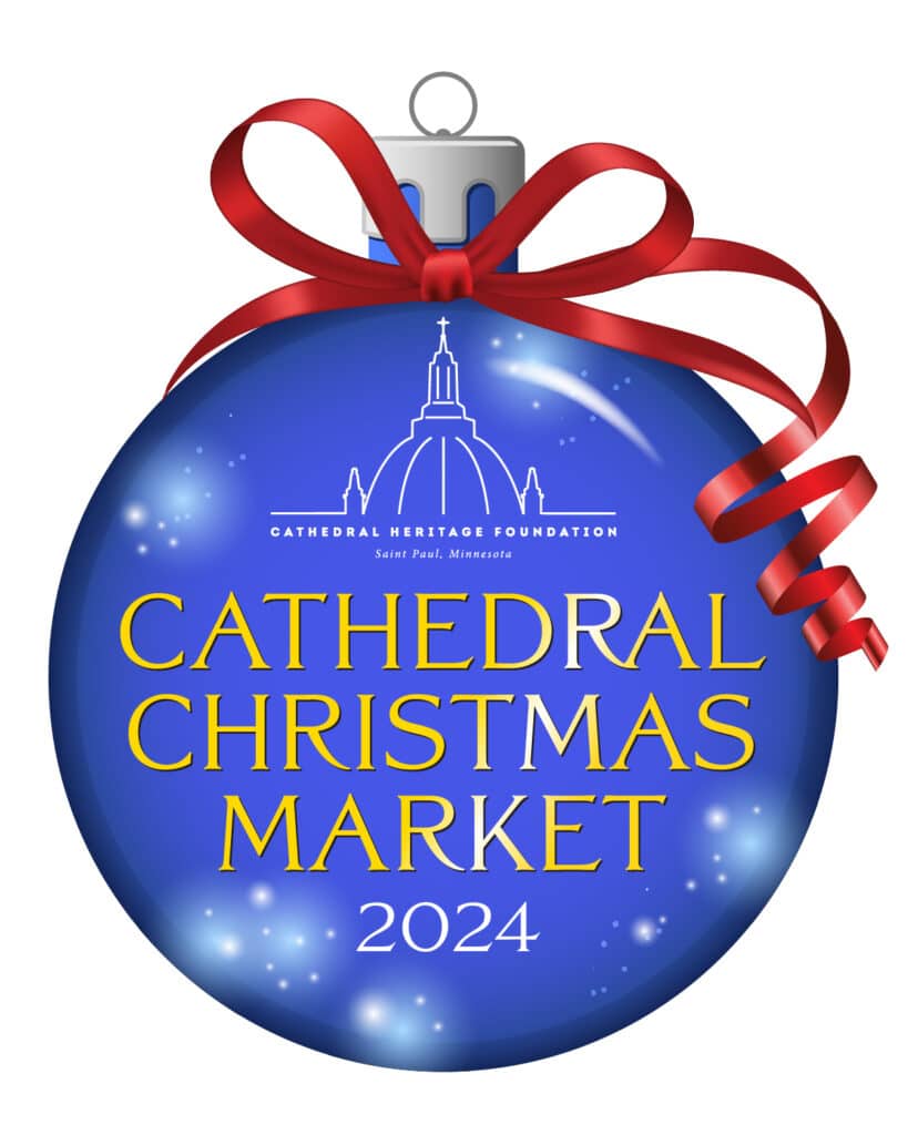 Minnesota’s 50 Best Christmas Markets to Visit in 2025 (You’ll Love #7!) 4 A blue Christmas ornament with a red ribbon reads “Cathedral Christmas Market 2024” and features the Cathedral Heritage Foundation logo.