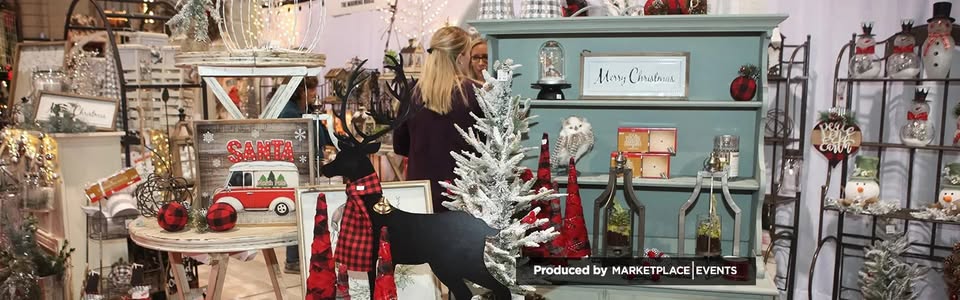 Ohio Christmas Markets 2025: 50 Unforgettable Holiday Events & Festive Fairs You Have to Visit 1 A woman browses Christmas-themed decorations, including snowmen, reindeer, trees, and festive signs, displayed on shelves and tables in a well-lit indoor market.