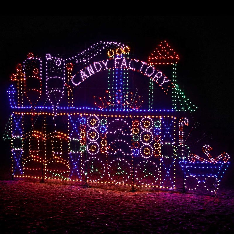 10 Jaw-Dropping Christmas Light Shows in New Hampshire You Can’t Miss in 2025 (With Insider Tips & Hidden Gems!) 6 Colorful light display in the shape of a candy factory with the words “Candy Factory” illuminated at night.