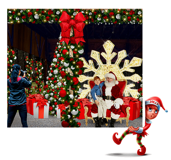 10 Jaw-Dropping Christmas Light Shows in New Hampshire You Can’t Miss in 2025 (With Insider Tips & Hidden Gems!) 3 A child sits on Santa’s lap near a Christmas tree as a person takes a photo; large ornaments, gifts, and a snowflake decoration are in the background. An elf cartoon stands in the foreground.